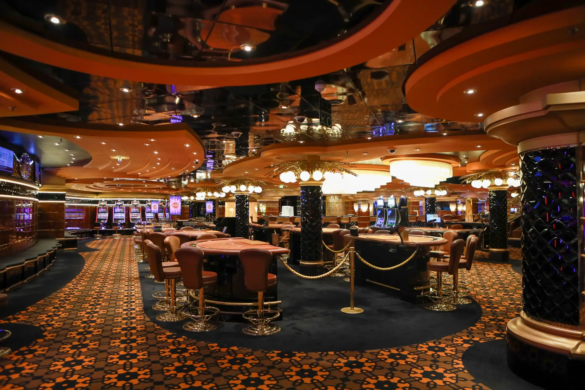 Luxurious casino gaming floor with elegant lighting