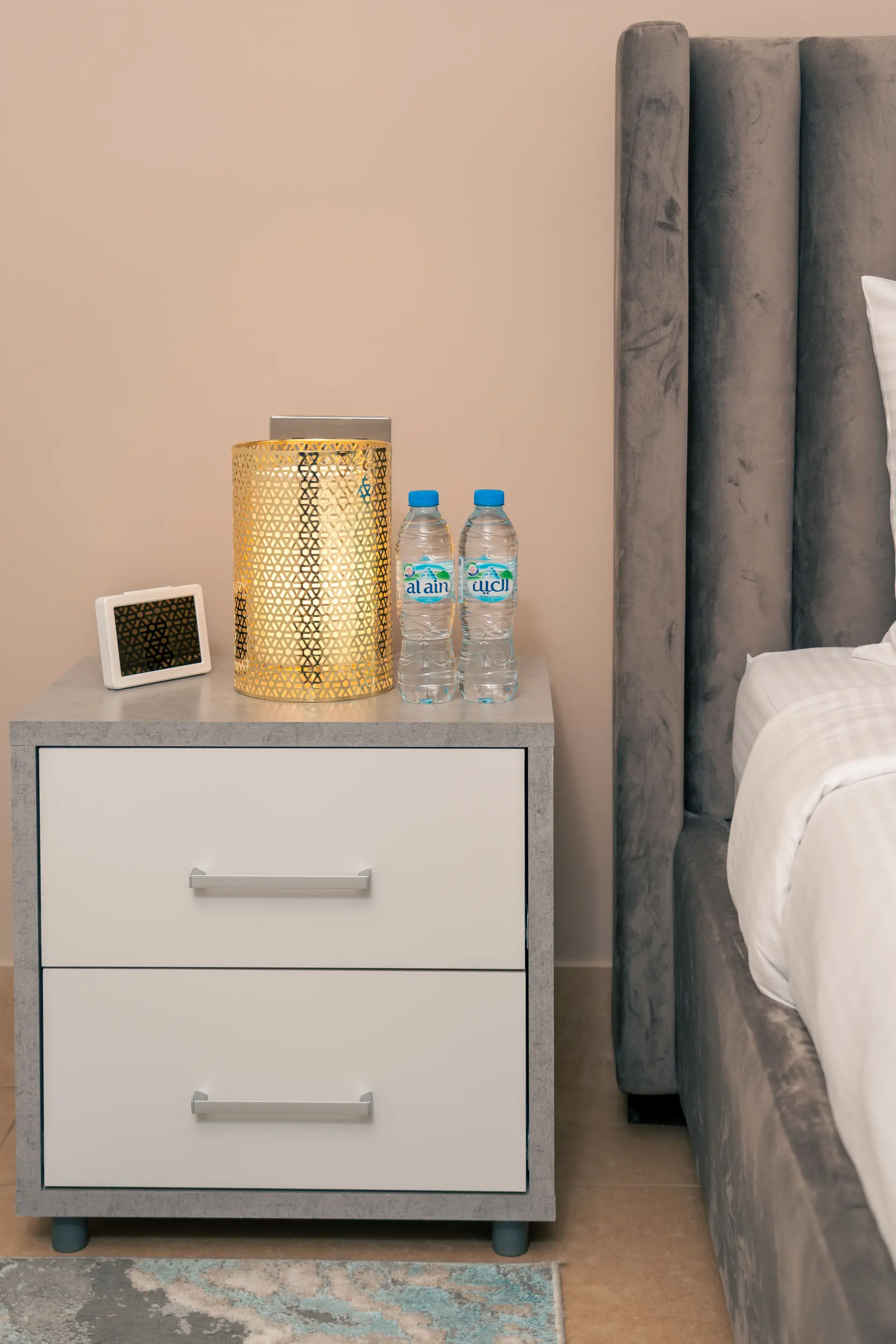 Sophisticated nightstand setup with modern hotel amenities