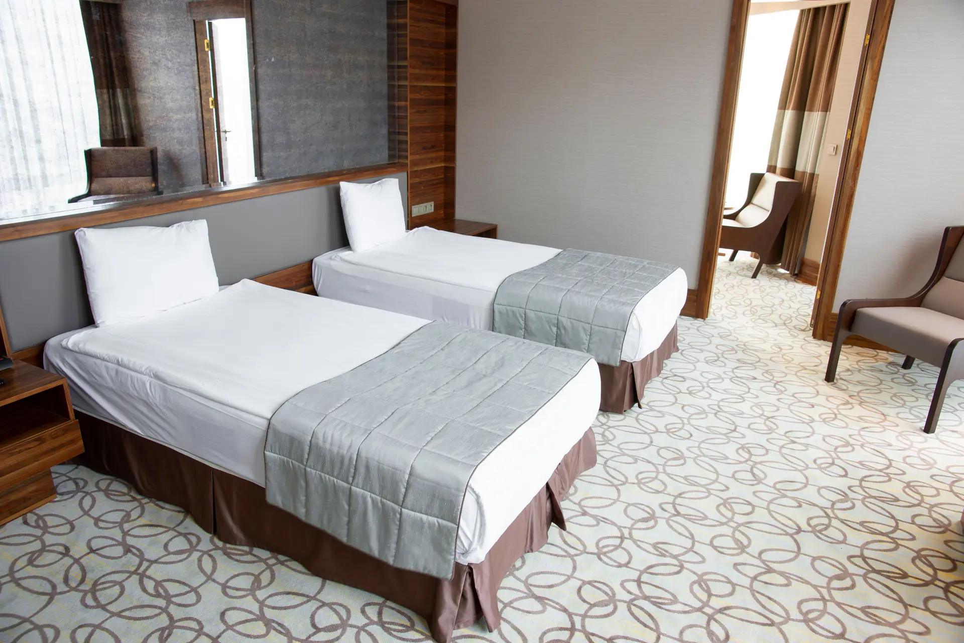 Standard Guest Room featuring twin beds and elegant casino-inspired decor