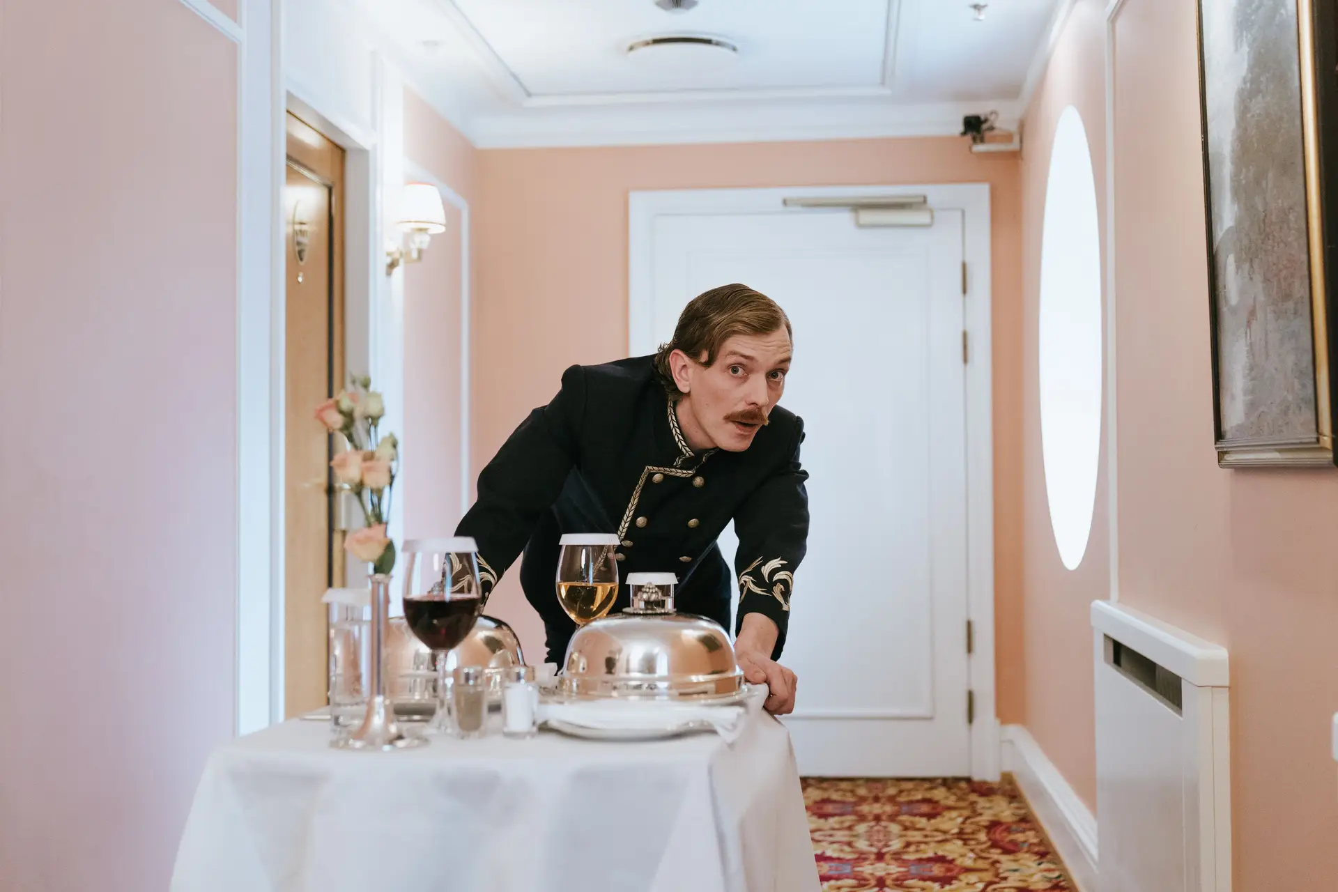 Attentive staff member delivering premium room service
